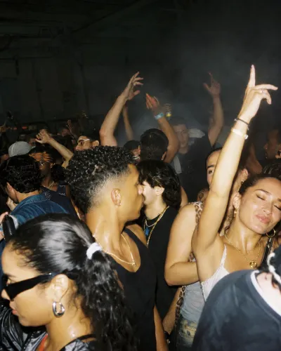 Hands up in a smoky warehouse