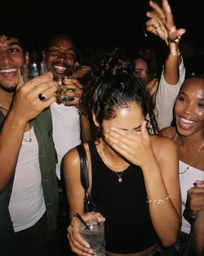 Friends laughing with drinks