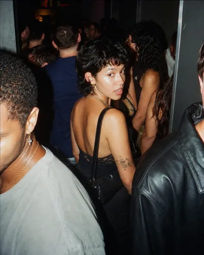 A glance back in a packed hallway