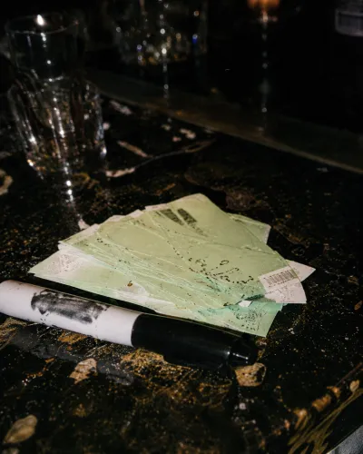 Tickets and a marker on the bar