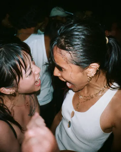 Two friends laughing on the floor